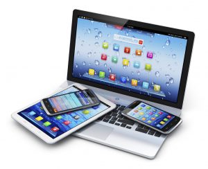 Mobile devices, wireless communication technology and internet web concept: business laptop or office notebook, tablet computer PC and modern black glossy touchscreen smartphones with colorful application interfaces isolated on white background