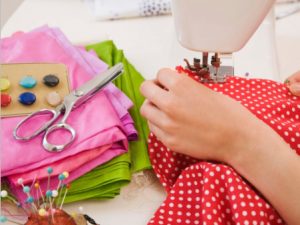 Woman using sewing machine